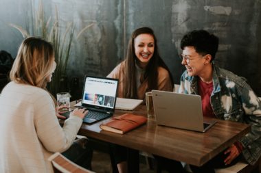 Group of laughing women at a business meeting